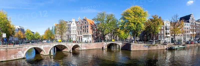 Canals and bridges building panorama at the Keizersgracht in the city of Amsterdam, Netherlands