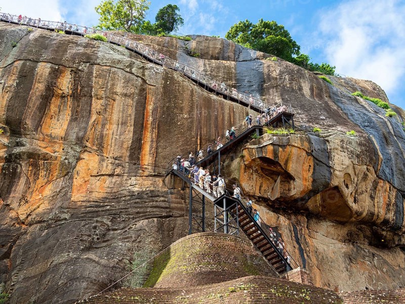 Visitors climb the stairs at Sigiriya Rock, Sri Lanka, Asia