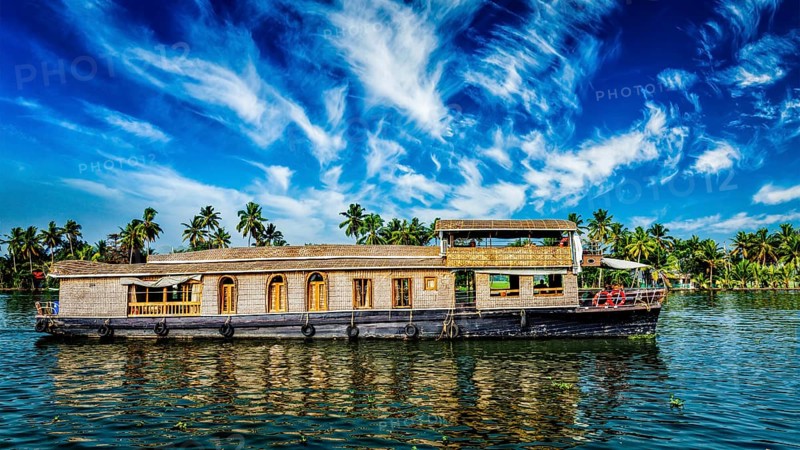 Kerala India travel background, panorama of tourist houseboat on Kerala backwaters. Kerala, India, Asia