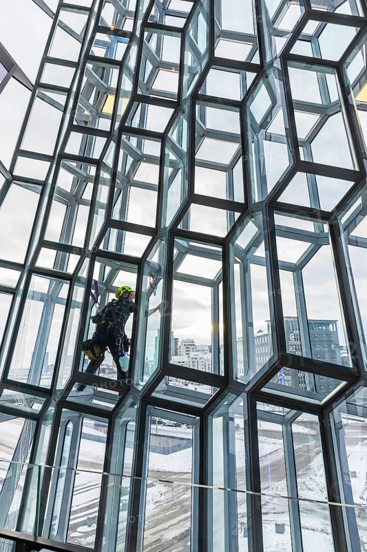 Window cleaners cleaning the glass facade of the Harpa Concert Hall and Congress Centre, interior view, Reykjanes Peninsula, Sudurnes, Iceland, Europe