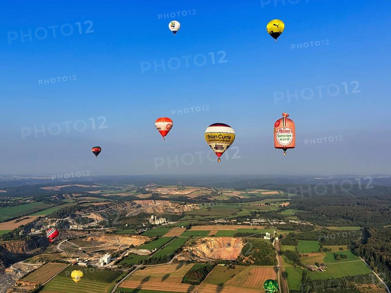 Many different hot-air balloons travelling in the blue sky, advertising, logo, hot-air balloon festival, 26th Warsteiner International Montgolfiade, aerial photo, Warstein, Sauerland, North Rhine-Westphalia, Germany, Europe