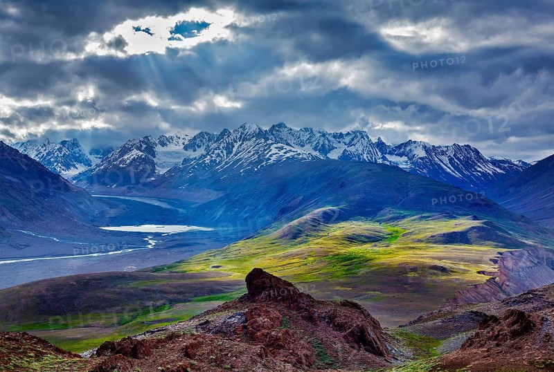 Himalayan landscape near Chandra Tal lake with sun rays coming through clouds. Himachal Pradesh, India Spiti Valley, Himachal Pradesh, India, Asia