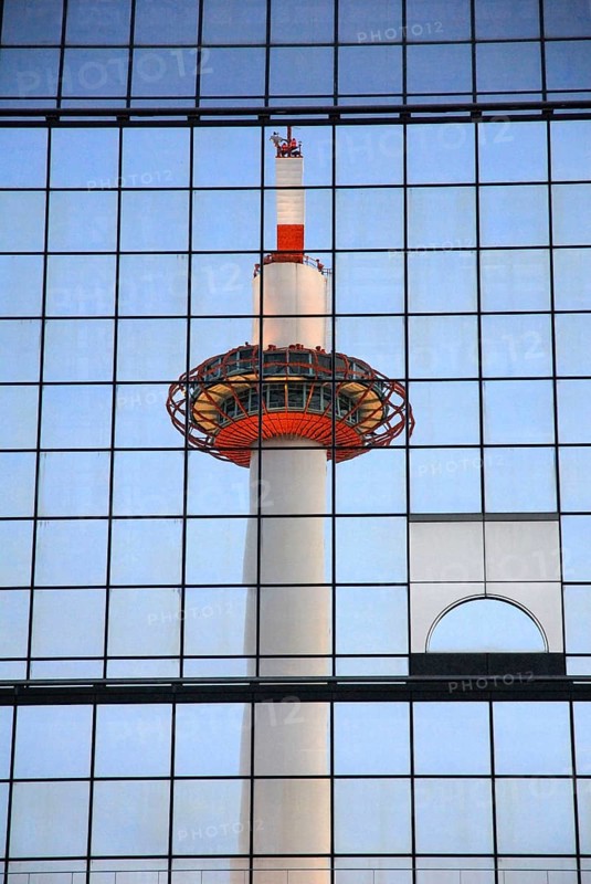 Kyoto Tower, reflected in the glass facade of the central station, Kyoto, Japan, Asia