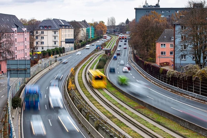Motorway A40, Ruhrschnellweg, skyline of the city centre of Essen, exit Essen-Huttrop, track bus route, this area would also be affected by a diesel driving ban, Essen, North Rhine-Westphalia, Germany, Europe