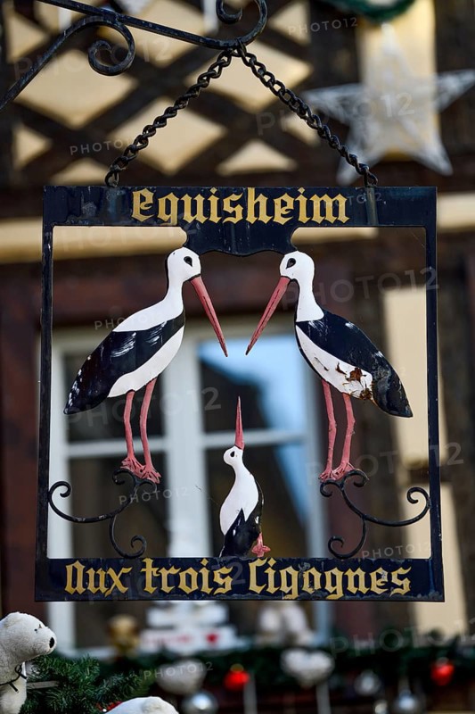 Sign at the restaurant Aux Trois Cigognes, Eguisheim, Département Haut-Rhin, Region Grand Est, Alsace, France, Europe