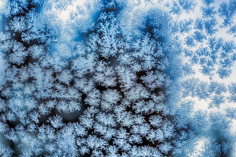 Ice crystals, snow crystals on glass, window pane of a flat in winter, illustration, symbol image, wallpaper