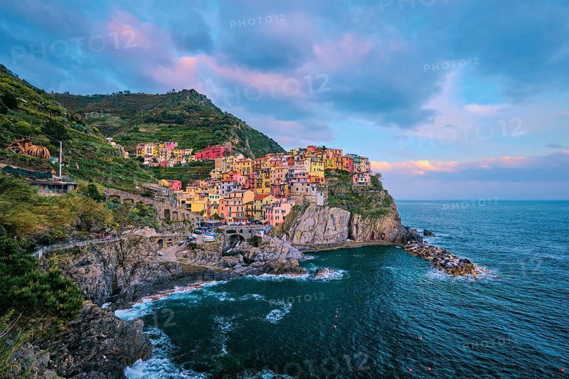 Manarola village popular european italian tourist destination in Cinque Terre National Park UNESCO World Heritage Site, Liguria, Italy on sunset