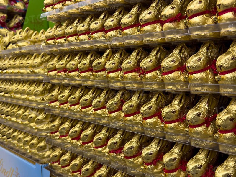 Display on retail shelf wholesale of large quantity of chocolate Easter bunnies chocolate Easter bunnies chocolate Easter bunnies wrapped in golden gold coloured staniol paper, Germany, Europe