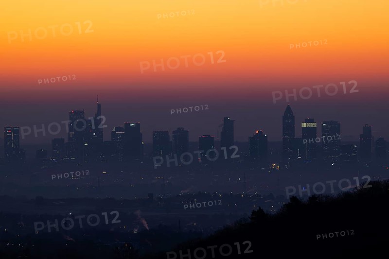 Shortly in front of sunrise, the sky behind the Frankfurt banking skyline turns yellow and orange, Frankfurt am Main, Kronberg Malerblick, Hesse, Germany, Europe
