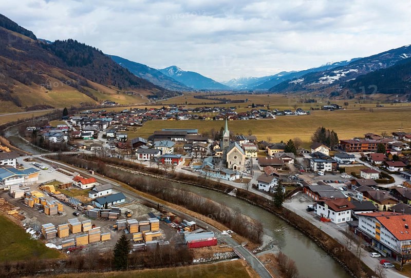 Drone image, residential buildings, view of village with parish church, Niedernsill, Salzach, Pinzgau, Salzburg province, Austria, Europe