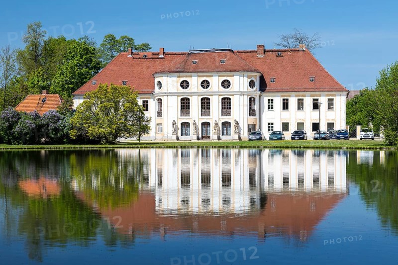 Baroque castle with reflection in the large pond, Königswartha, Upper Lusatia, Saxony, Germany, Europe