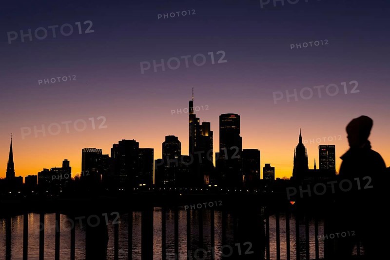 The silhouette of Frankfurt's banking skyline stands out in the evening against the residual light of the setting sun, Frankfurt am Main, Hesse, Germany, Europe