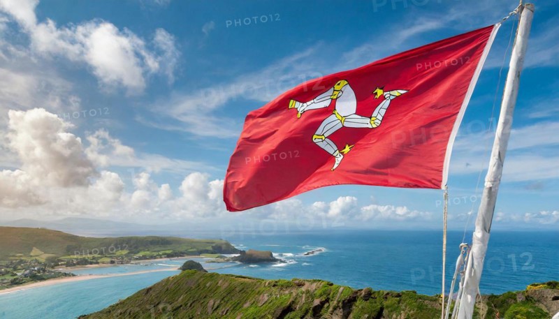 The flag of the Isle of Man, Great Britain, flutters in the wind