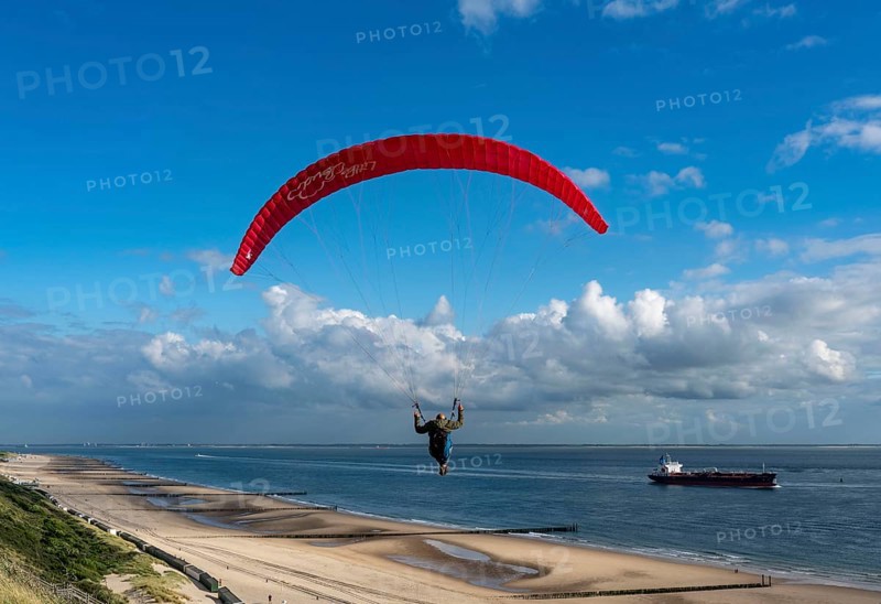 Paragliders along the dunes of Zoutelande, in Zeeland, South Holland, Netherlands