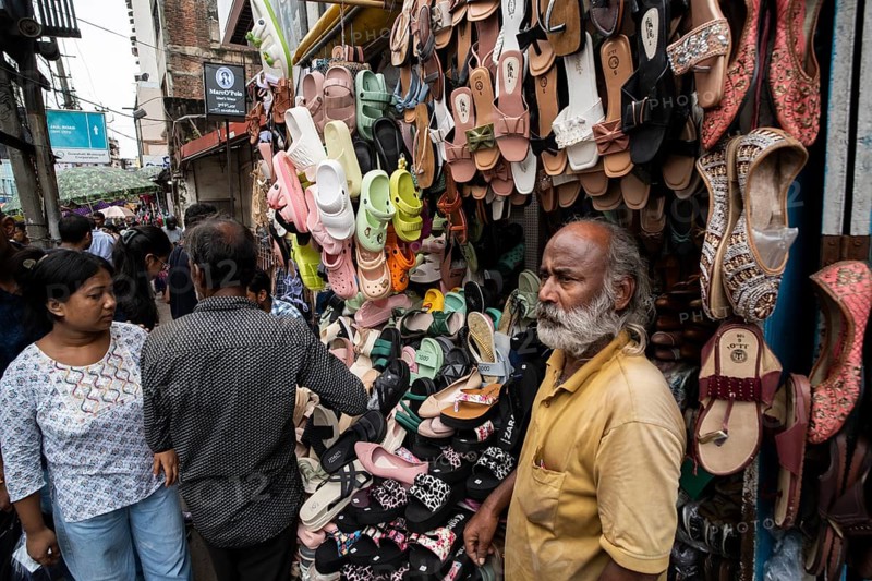 A vendor sells shoes and sandals at a street market ahead of Durga Puja festival on October 7, 2024 in Guwahati, India. Shopping ahead of Durga Puja is a major event, as people prepare for the celebration