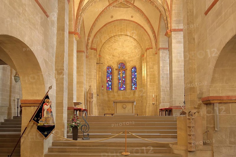 Chancel of the Romanesque Basilica of St. Lubentius, flag of St. Lubentius, interior view, colourful church windows, Dietkirchen, Limburg, Hesse, Germany, Europe