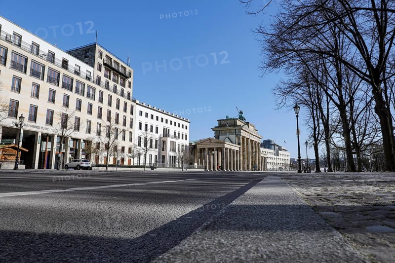 The Brandenburg Gate in Berlin. Where many hundreds of people usually linger to visit the government district, there is now an eerie silence. Public life in Berlin has almost come to a standstill following the protective measures recently adopted to prevent the spread of the coronavirus. All sights, museums, squares, streets, restaurants, universities, 23.03.2020 are affected