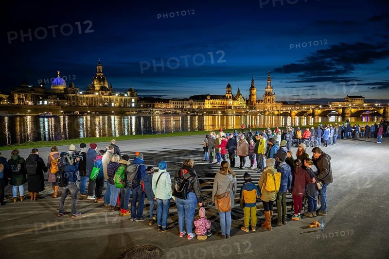 On 13 and 14 February 1945, Dresden was heavily destroyed in three Allied bombing raids. Every year, the people of Dresden commemorate this event at various events. A long human chain symbolised the protection of the city centre. Here looking from the Königsufer across the Elbe to the Old Town, Dresden, Saxony, Germany, Europe