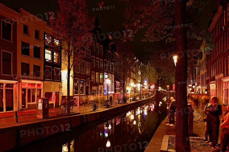 Night shot of the Oudezijds Achterburgwal in the red light district in Amsterdam, North Holland, Netherlands