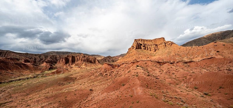 Eroded mountain landscape with sandstone cliffs, red and orange rock formations, Konorchek Canyon, Chuy, Kyrgyzstan, Asia