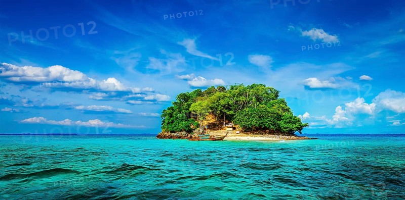 Panorama of tropical island and long-tail boat in sea. Thailand