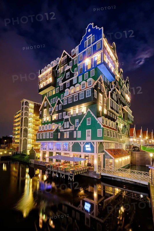 ZAANDAM, NETHERLANDS, MAY 21, 2018: Inntel Hotel in Zaandam illuminated at night. Design of 12-storey tall building opened in 2009 is the result of stacking a series of traditional Dutch houses