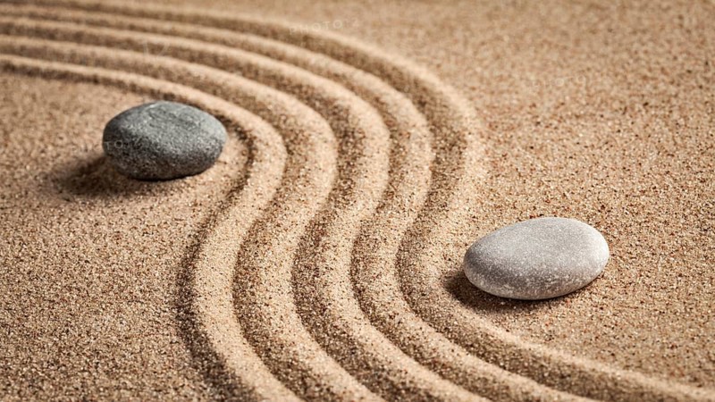 Japanese Zen stone garden, relaxation, meditation, simplicity and balance concept, panorama of pebbles and raked sand tranquil calm scene