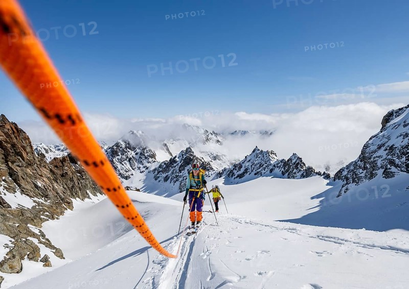 Ski tourer with rope, rope team on the Vadret da Porchabella glacier on the ascent to the summit of Piz Kesch, mountain landscape in winter, alpine tour, ski tour Bündner Haute Route, Albula Alps, Rhaetian Alps, Grisons, Eastern Switzerland, Switzerland, Europe