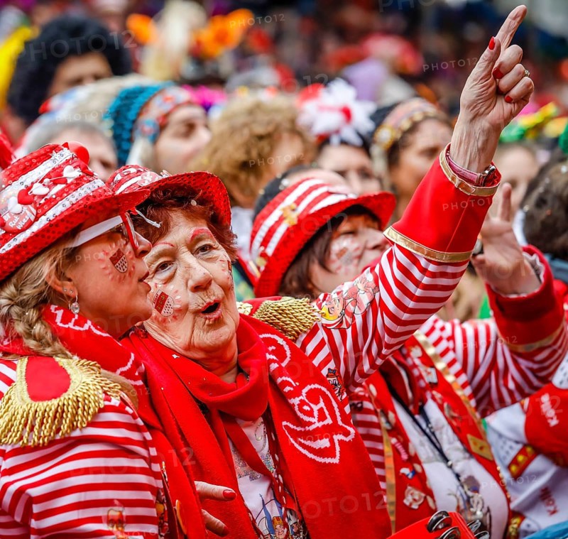 Colourfully costumed carnivalists celebrate carnival in Cologne, on Weiberfastnacht the street carnival is traditionally opened on the Alter Markt, which then reaches its climax on Rosenmontag, Cologne, Rhineland, North Rhine-Westphalia, Germany, Europe