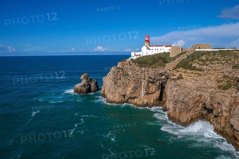 Sagres, Algarve, Portugal - Lighthouse at the Cap de Sao Vicente. Historical sight. Rocky headland with a lighthouse, considered the most south-westerly point in Portugal