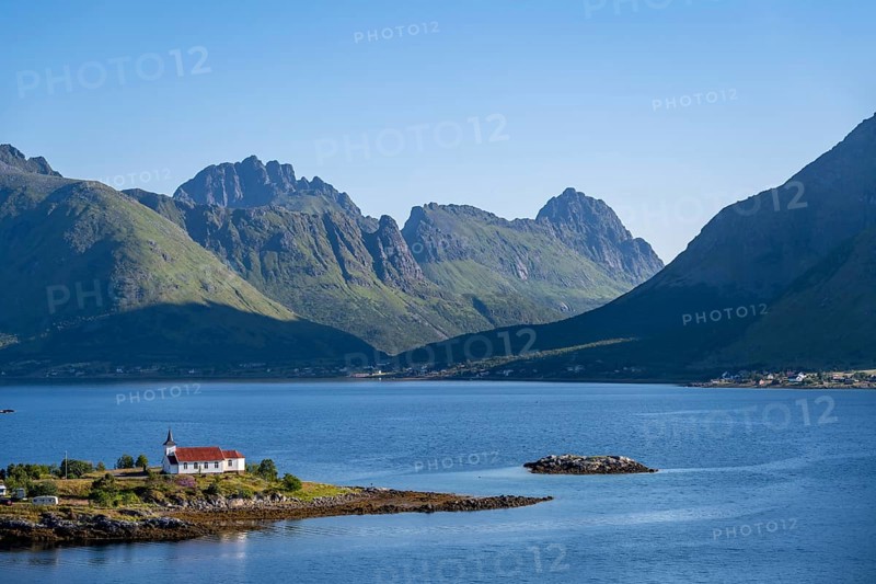 Small church Sildpollnes Kirke at the fjord Austnesfjorden, idyllic Norwegian fjord landscape, Sildpollen, Nordland, Norway, Europe