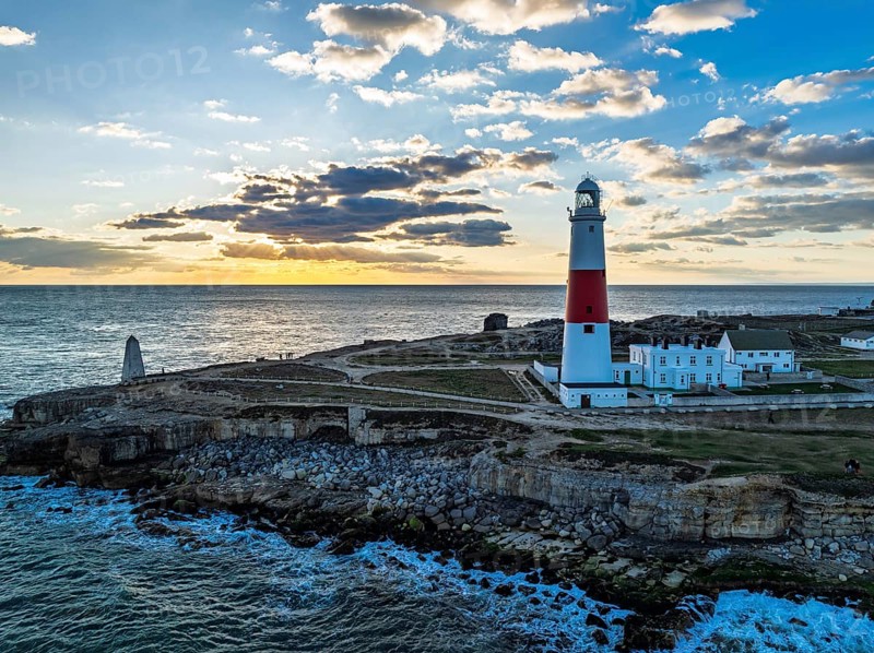 Sunset over Portland Bill Lighthouse from a drone, Portland Bill, Isle of Portland, Dorset, England, United Kingdom, Europe