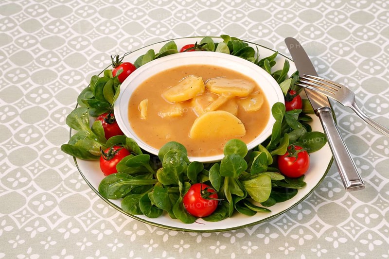 Swabian cuisine, sour potato wheels, potato slices in sour sauce, healthy cuisine, typical Swabian, home cooking, traditional cuisine, food photography, studio
