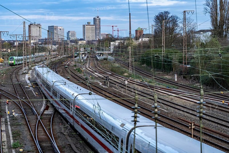 Train on the tracks west of Essen central station, skyline of the city centre, ICE train, North Rhine-Westphalia, Germany, Europe