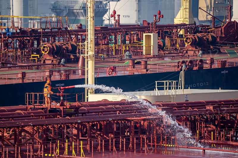 The crude oil tanker HOJO, in the seaport of Rotterdam, in the petroleum harbour, Europoort, ship personnel checking the fire extinguishing equipment, pipelines, Rotterdam, Netherlands