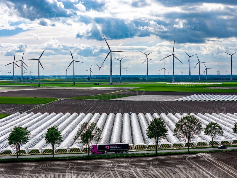 Agriculture, large areas with foil tunnel, for the cultivation of strawberries, freshly cultivated fields, wind farm, south of Lövenich, belongs to Erkelenz, in the district of Heinsberg