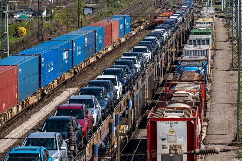 Duisburg-Rheinhausen freight station, at the Logport harbour area, goods trains loaded with new cars, various tank containers and the container train from China, on its way to the Logport, part of the new Silk Road, Duisburg, North Rhine-Westphalia, Germany, Europe