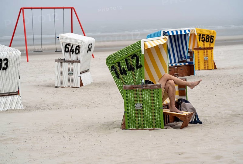 North Sea island Langeoog, early summer, shortly after the first easing of the lockdown in the Corona crisis, foggy weather, still quite few tourists on the beach, beach chairs, Lower Saxony, Germany, Europe