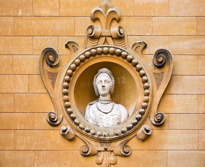 Holford family bust portrait in wall of Westonbirt House and School, Tetbury, Gloucestershire, England, UK