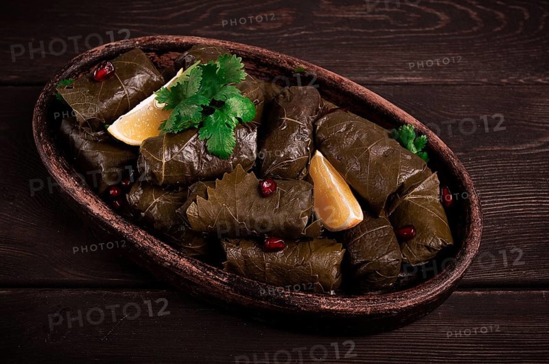 Dolma (Tolma) stuffed rolls, minced meat with rice, in grape leaves, top view, no people, close-up