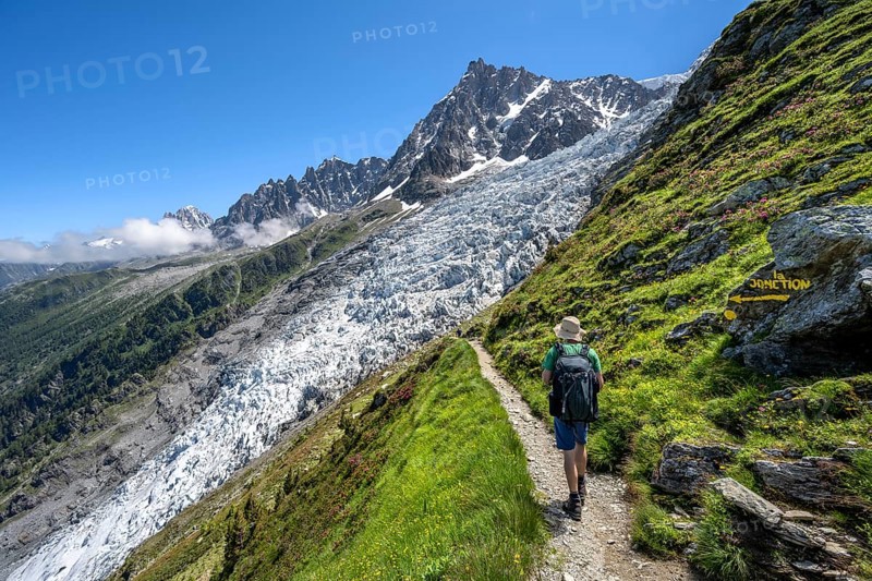 Hiking on the trail to La Jonction, Glacier des Bossons, behind the summit of the Aiguille du Midi, Chamonix, Haute-Savoie, France, Europe