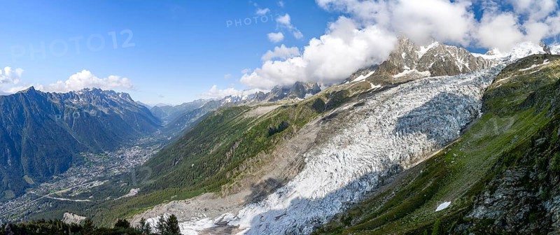 Panorama, mountain landscape with glacier Glacier des Bossons and summit of the Aiguille du Midi, view into the valley with village, Chamonix, Haute-Savoie, France, Europe