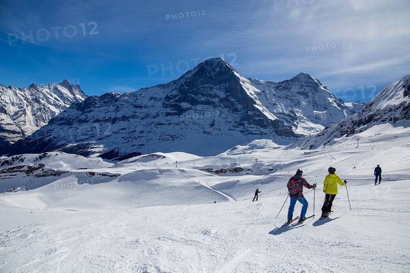 25 March 2024: Skiing against the backdrop of the north face of the Eiger in Grindelwald, Switzerland, Europe