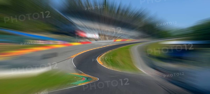 Panorama panoramic photo of Eau Rouge with dynamic speed effect from view tunnel view from racing car perspective of racing driver while driving into dangerous curve Eau Rouge on 40 metres high driveway Raidillon of race track Circuit de Spa Francorchamps, in the background 2022 newly built grandstand for car racing, FIA Formula 1 race track, Circuit de Spa Francorchamps, Ardennes roller coaster, Ardennes, Malmedy, Belgium, Europe