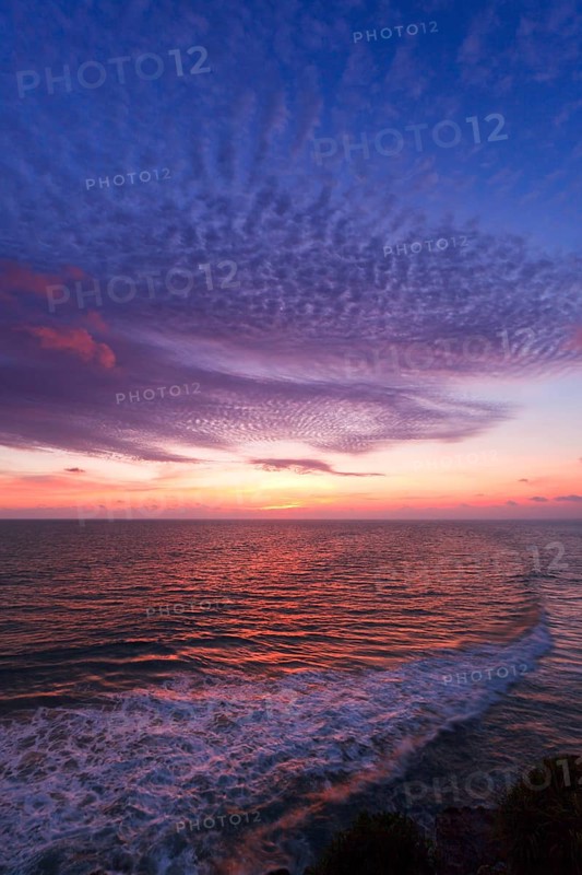 Ocean sunset on rocky coast. Varkala resort, Kerala, India, Asia