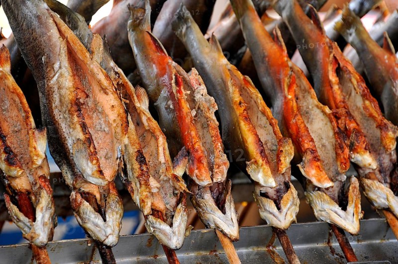 Steckerlfisch, fish, freshwater fish grilled on a stick over charcoal, historic Wies'n, Oide Wiesn, Oktoberfest, Munich, Upper Bavaria, Bavaria, Germany, Europe