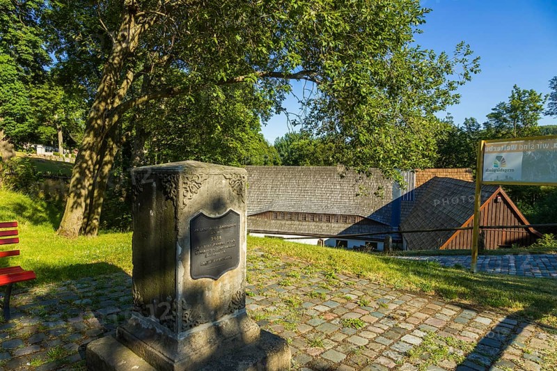 Memorial stone commemorating the beginning of tin mining in this region. An outstanding monument complex is the mining museum with its various viewing areas, which offer visitors a complete overview from underground ore extraction to ore processing in the ore washes above ground:The Neubeschert-Glück-Stollen, originally excavated in 1802 for exploratory purposes, now serves as a museum show tunnel, Altenberg, Altenberg, Saxony, Germany, Europe