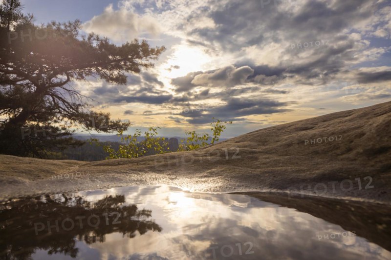 View from the Carolafelsen the sky is reflected in a puddle, Bad Schandau, Saxony, Germany, Europe
