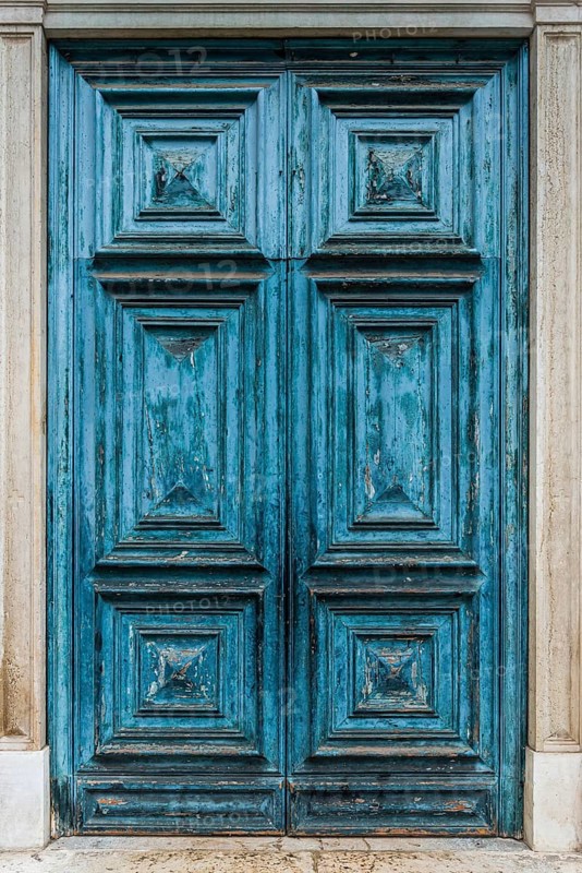 Old blue historic wooden door, dilapidated, withered, peeling, paint, craftsmanship