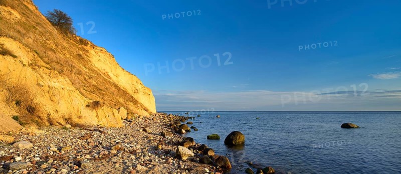 Cliffs and boulders on the coast of the Baltic Sea in the evening light, Reddevitzer Höft, Mönchgut peninsula, Rügen island, Mecklenburg-Western Pomerania, Germany, Europe
